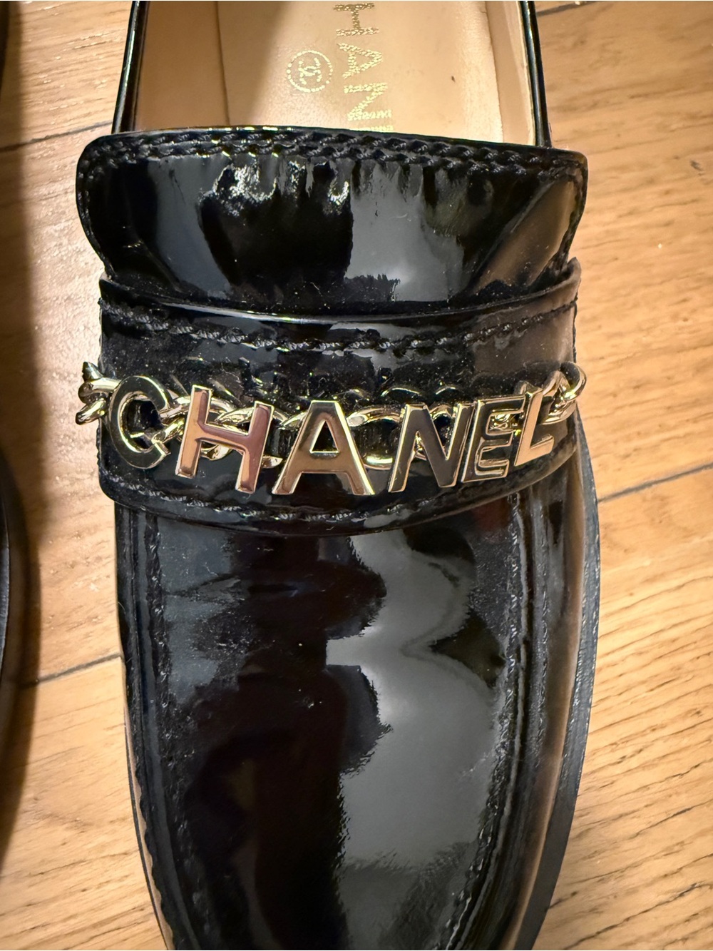 CHANEL Black Patent Leather Logo Chain Loafers - Picture 2 of 8